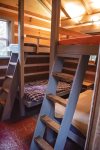 Ladders and windows encircle the bunks